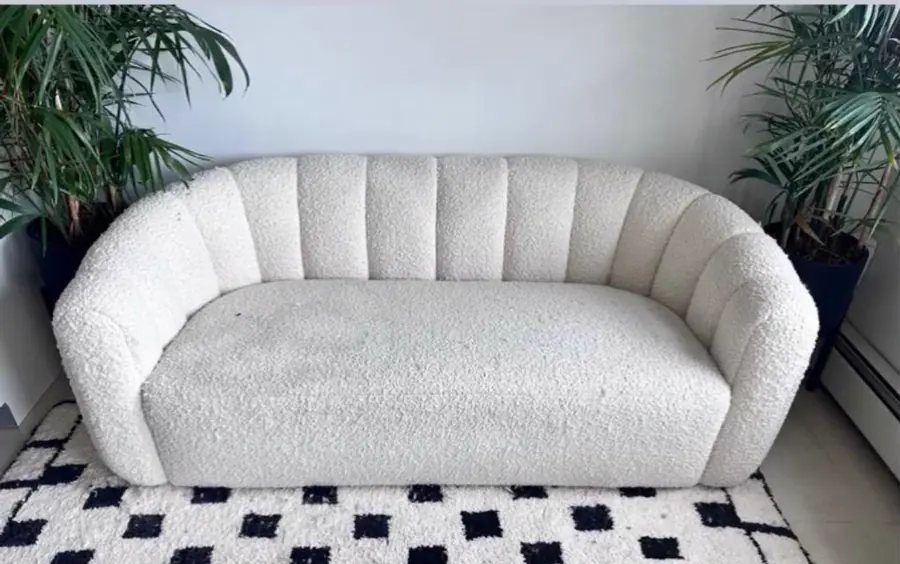 Before cleaning: textured white loveseat